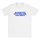 MY TUMMY HURTS BUT IM BEING REALLY BRAVE ABOUT IT - BABY TEE – White